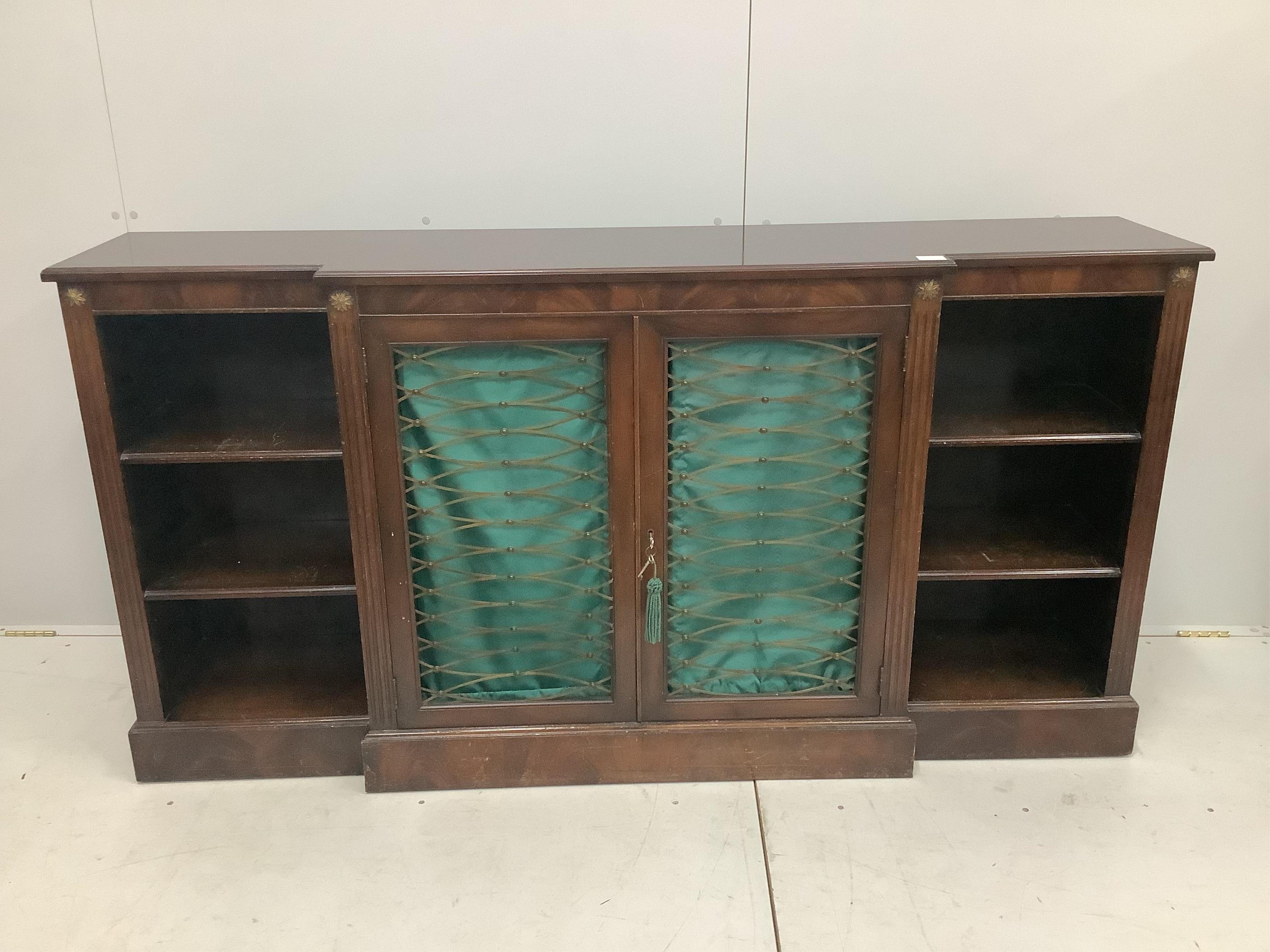 An Edwardian mahogany breakfront dwarf bookcase, width 178cm, height 92cm. Condition - poor